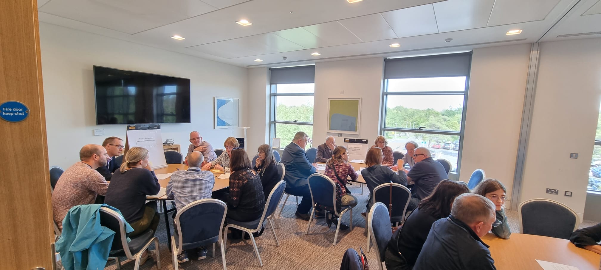 Patients sitting in a circle discussing cilia issues